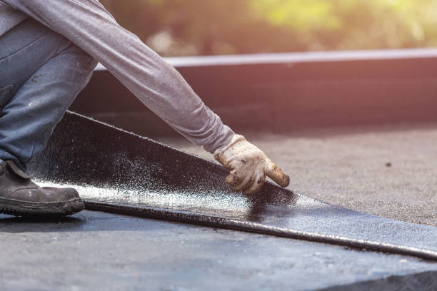 Professional Basement Waterproofing technician working in Minster, OH